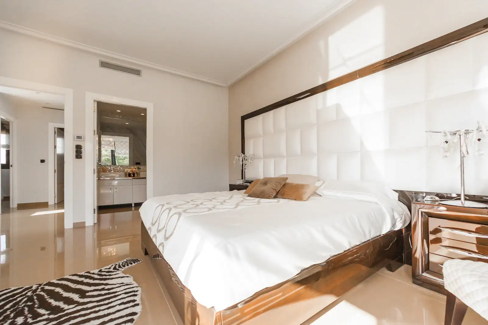 White bedroom with large windows