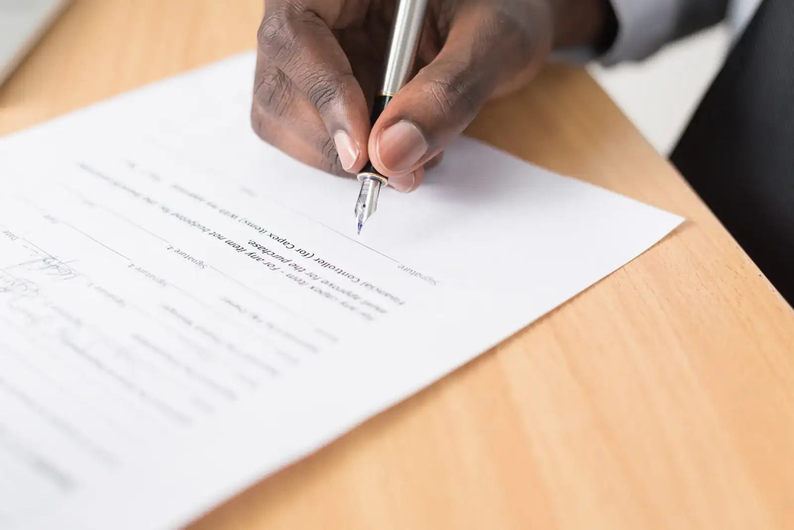 Hand signing an application form