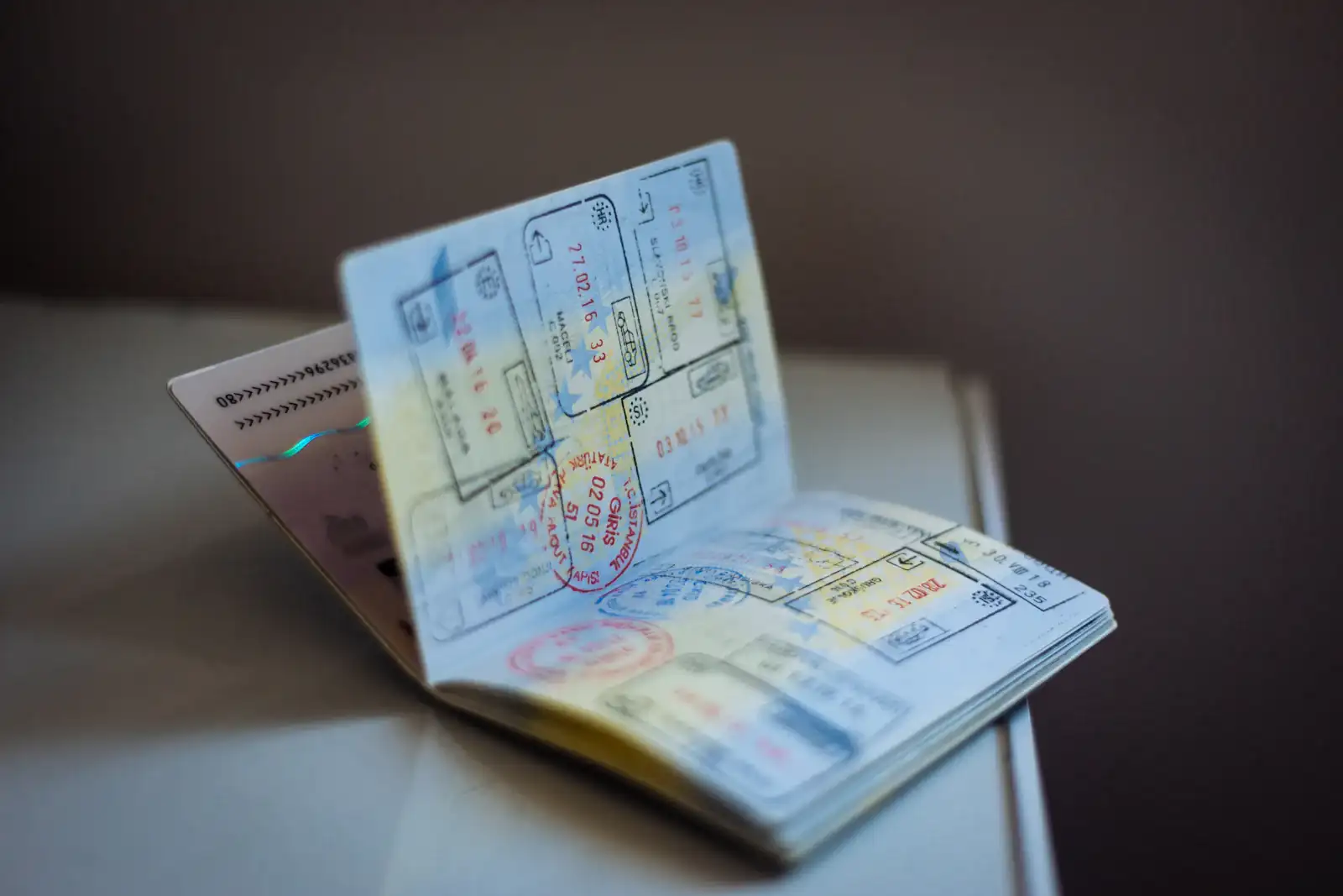 Open passport with visa stamps